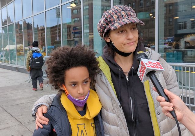 Screenshot of Irene Simon, a fitness instructor and mother standing by her son in Harlem.